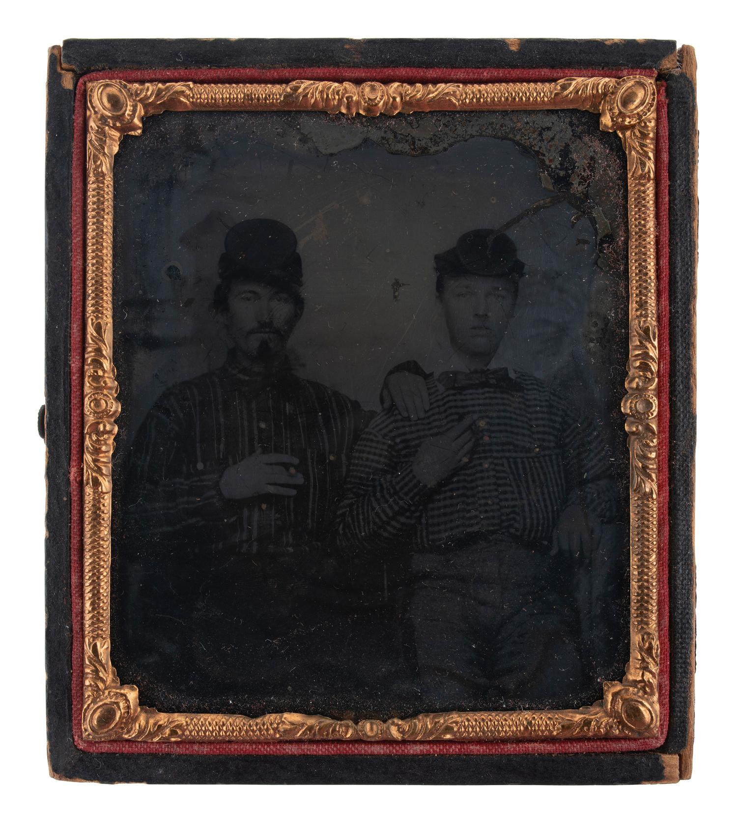 [EARLY PHOTOGRAPHY]. 3 cased images featuring subjects with cigars, including Civil War recruits.