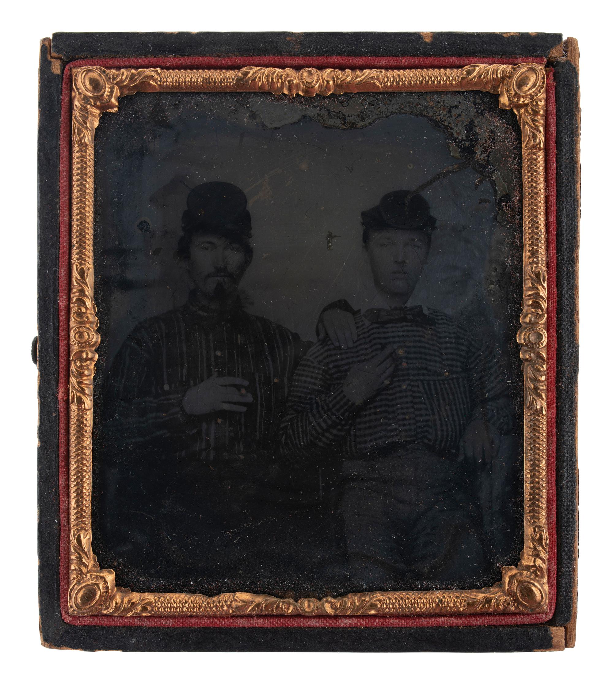 [EARLY PHOTOGRAPHY]. 3 cased images featuring subjects with cigars, including Civil War recruits.