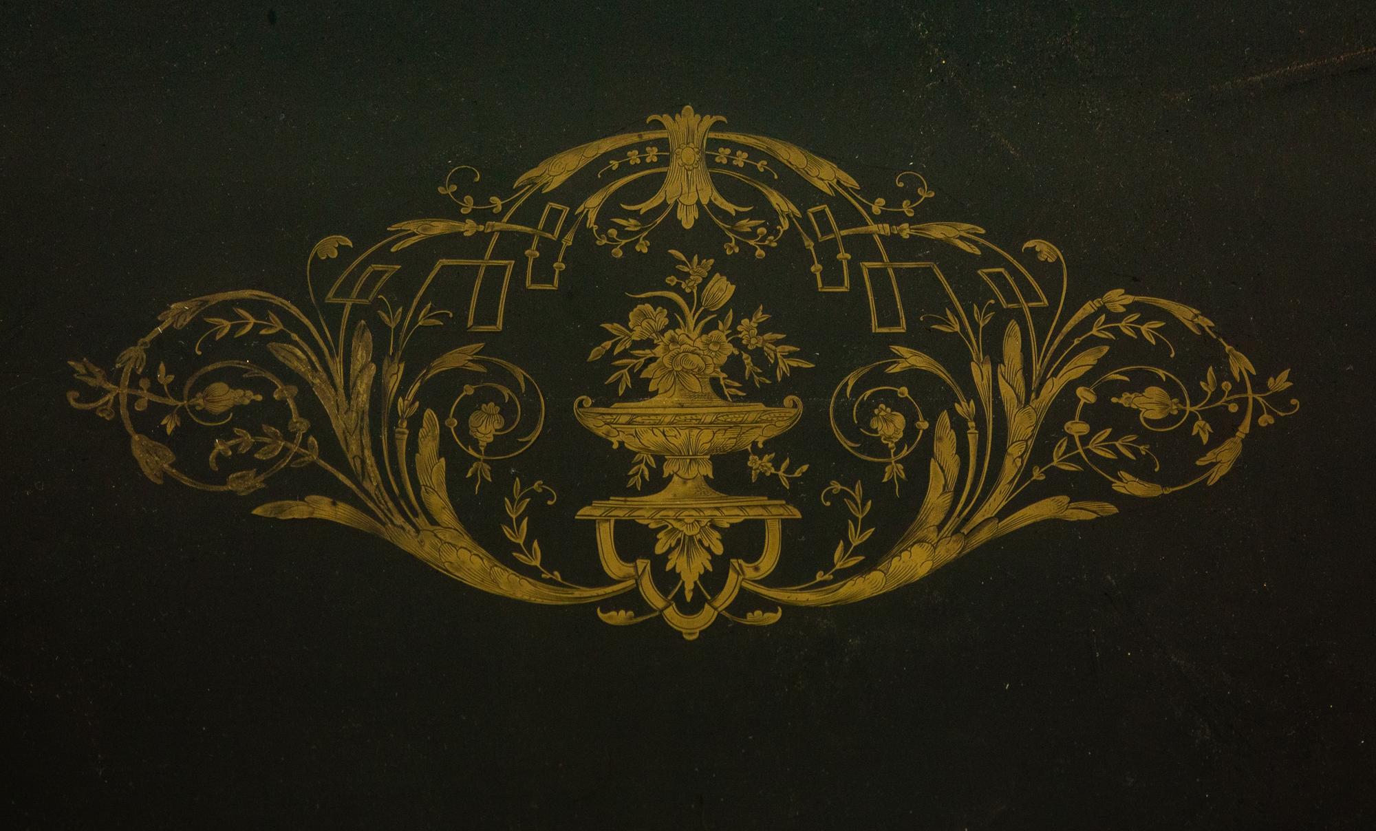 A Napoleon III Style Gilt-Bronze Mounted Ebonized Center Table