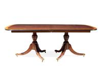 A Regency style two-pedestal inlaid mahogany and satinwood dining table, 20th century