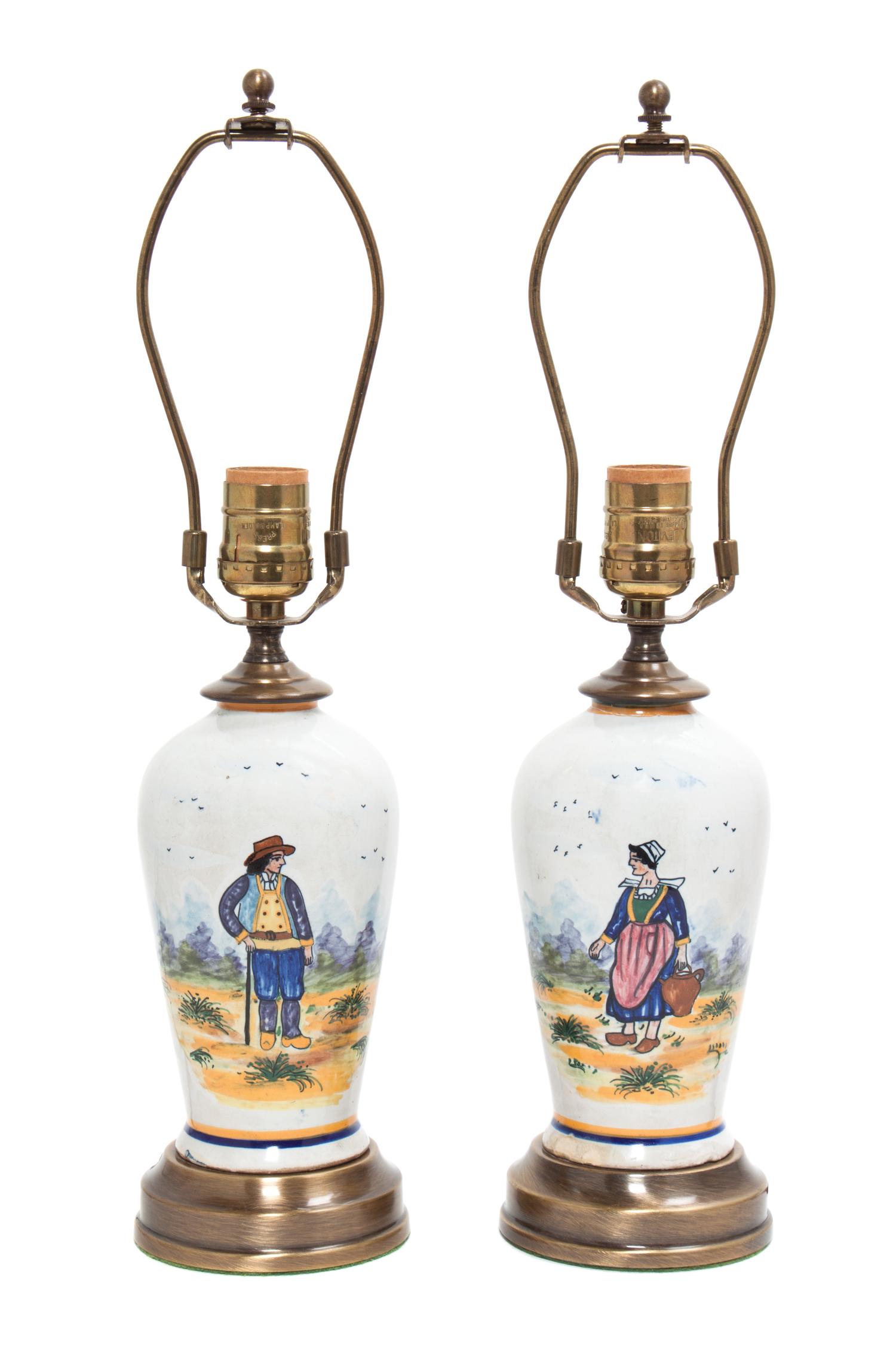 A Pair of Quimper Vases Height of each 16 3/4 inches.