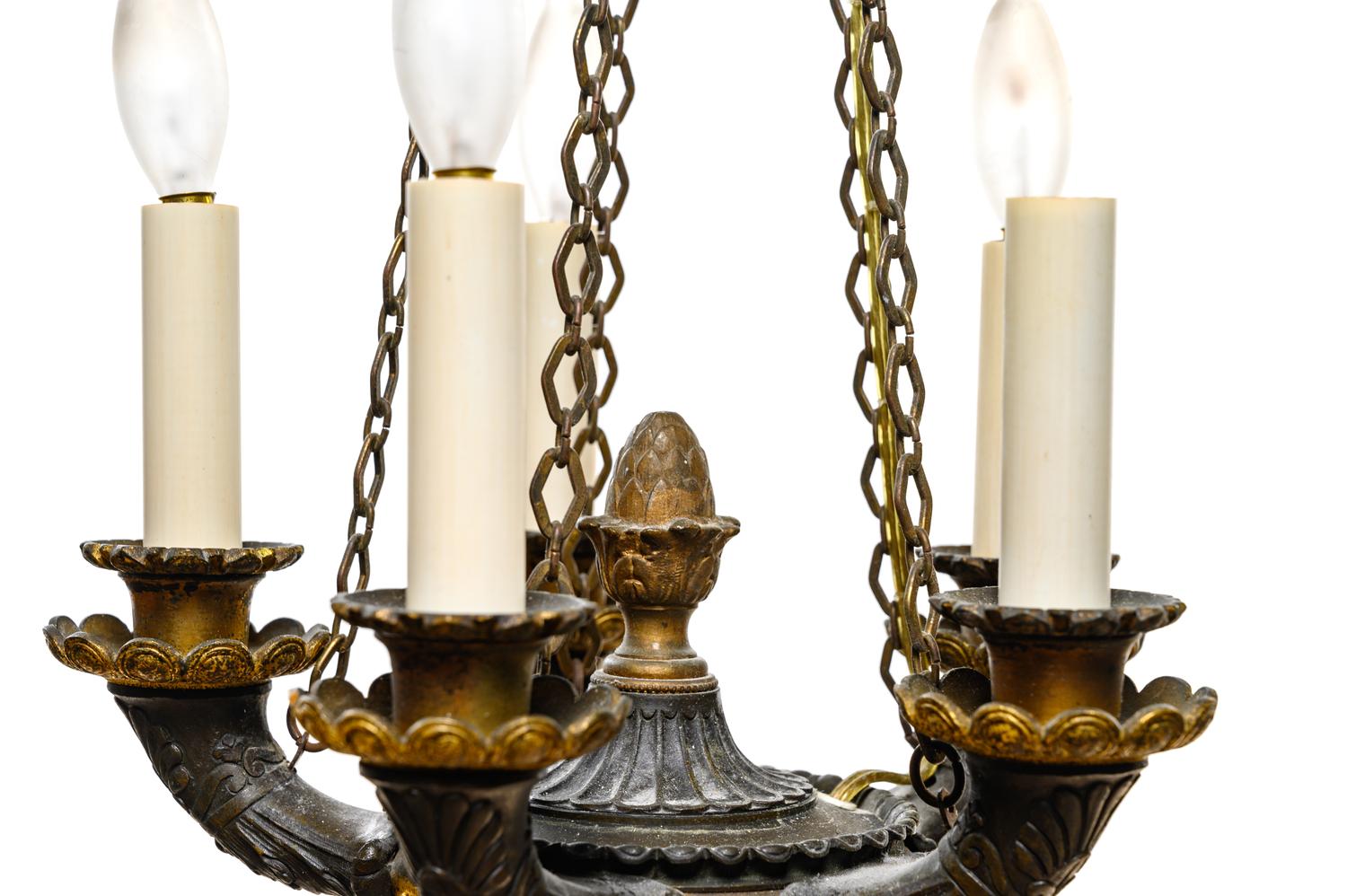 An Empire Style Gilt and Patinated Bronze Five-Light Chandelier