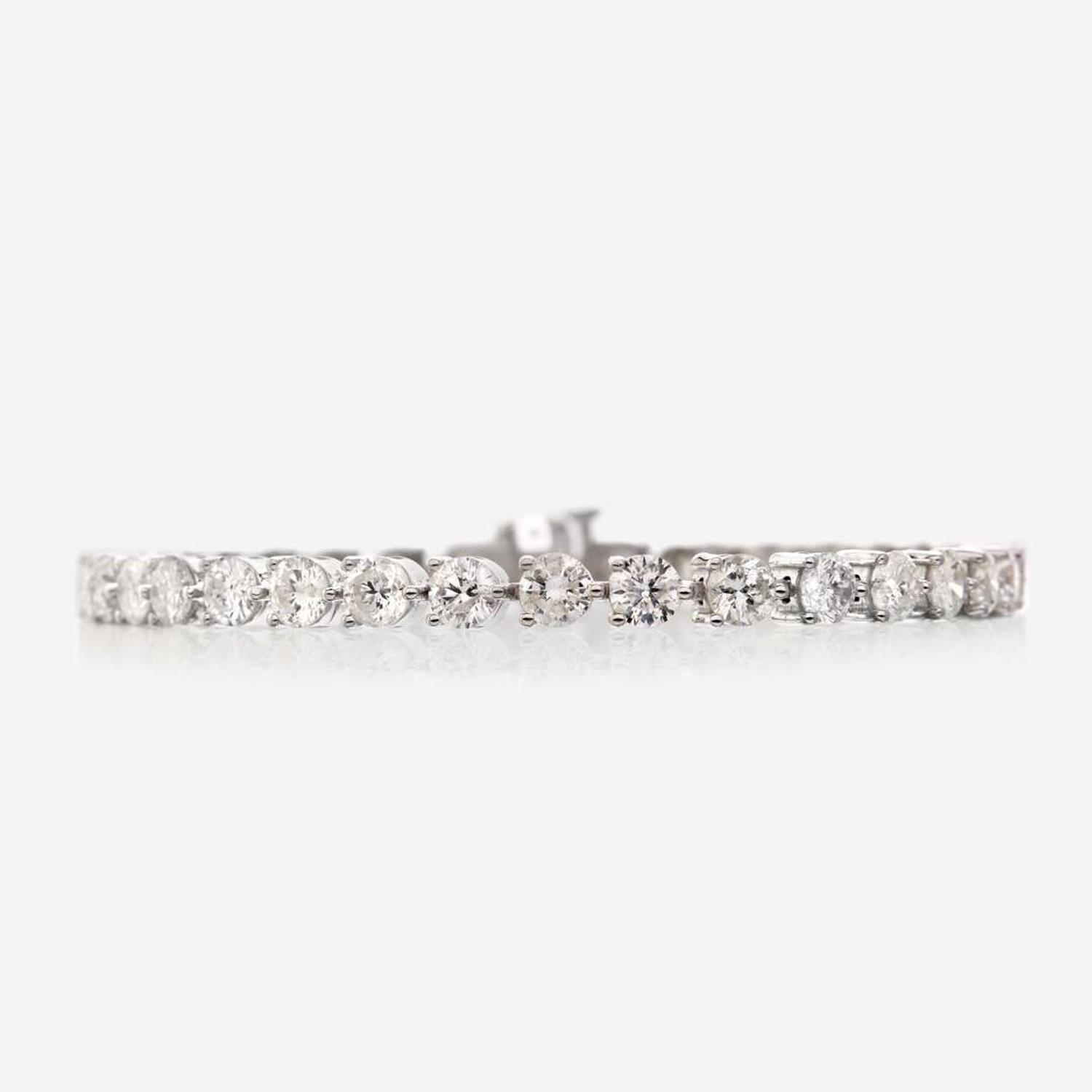 A diamond and eighteen karat white gold bracelet