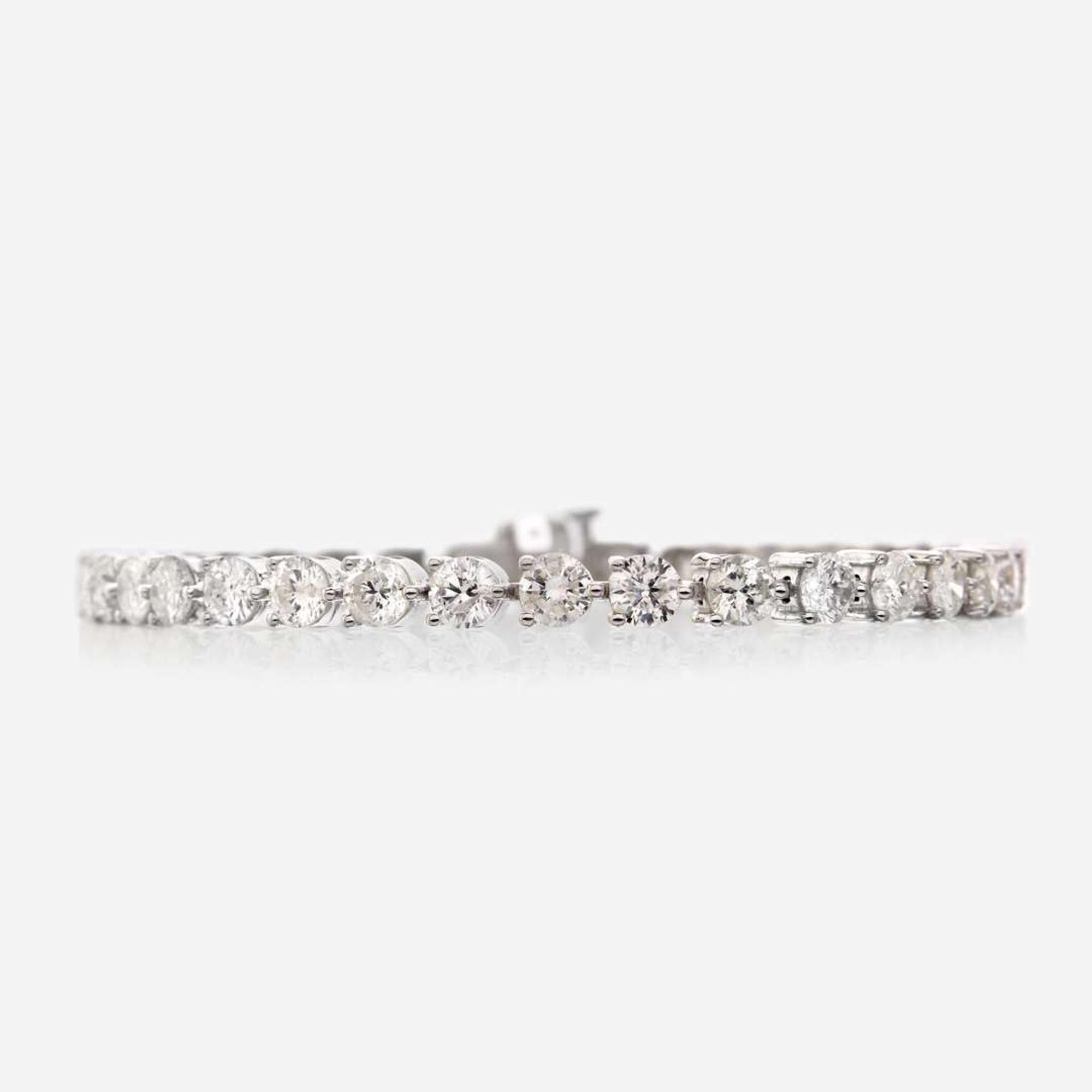 A diamond and eighteen karat white gold bracelet