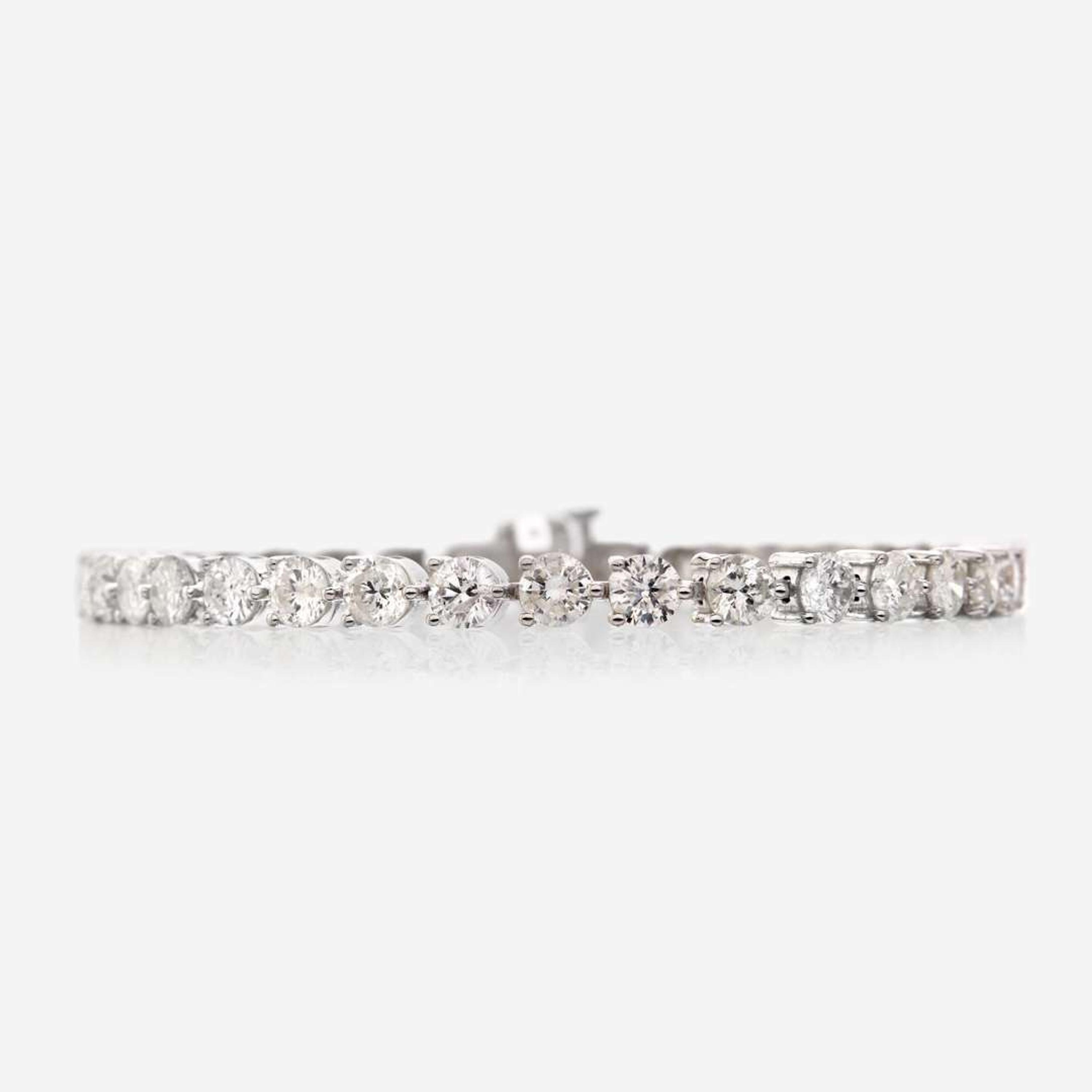 A diamond and eighteen karat white gold bracelet