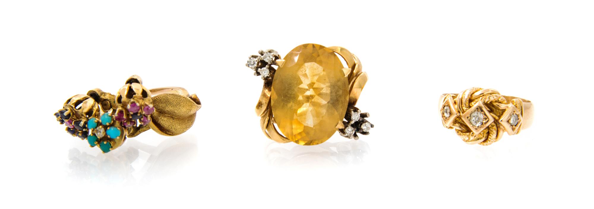 A Collection of Yellow Gold, Diamond and Gemstone Rings, 13.40 dwts.