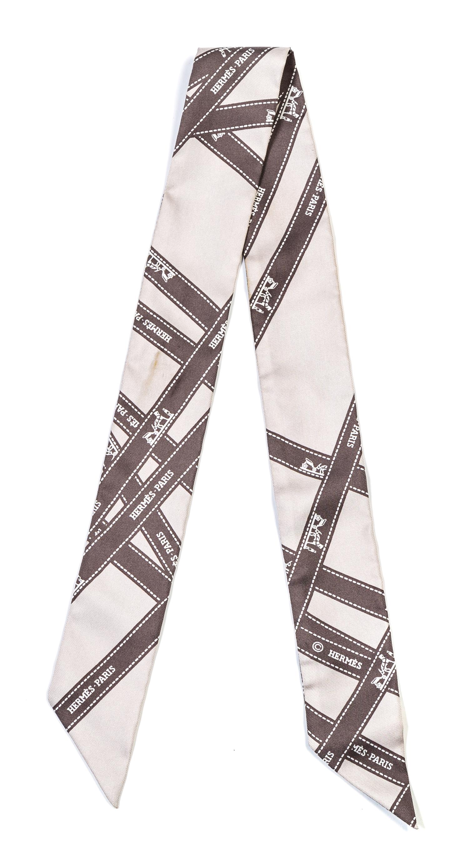 An Hermes Gray Silk Twilly Scarf, 36" x 36".