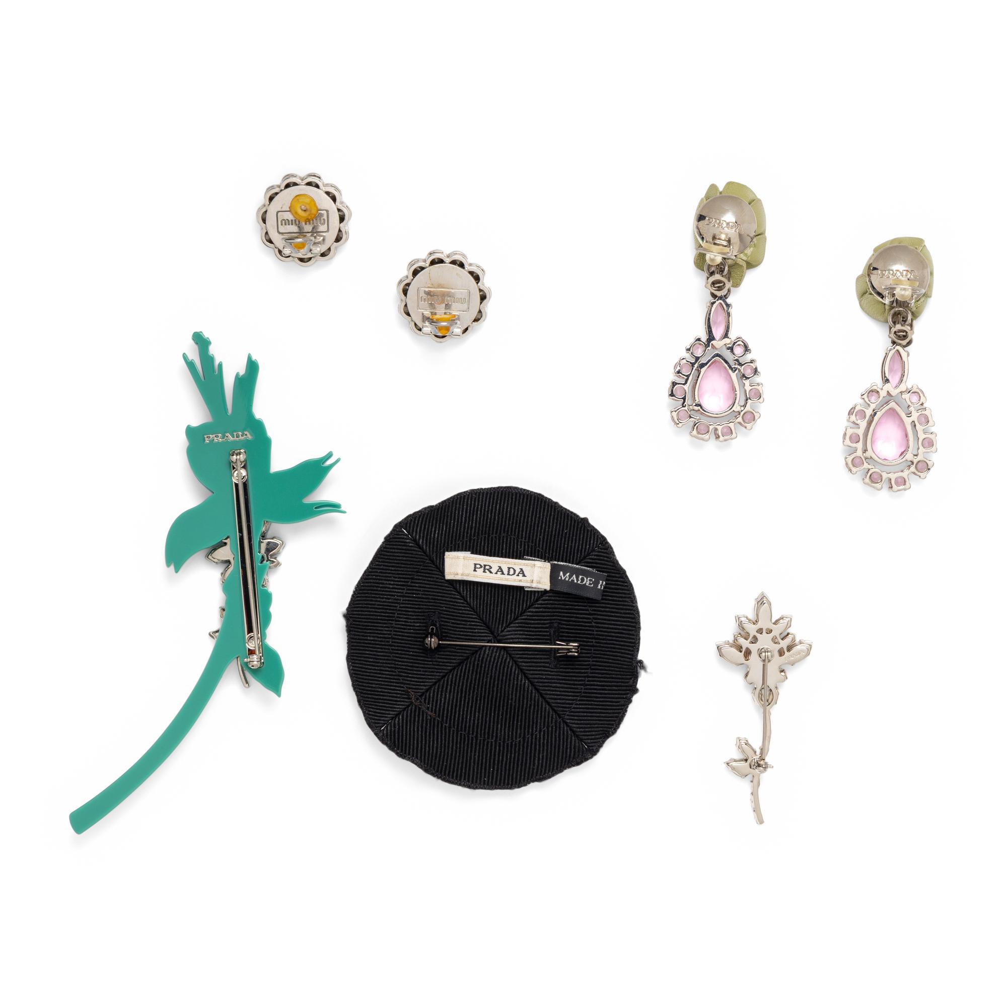 PRADA & MIU MIU, THREE BROOCHES & TWO PAIRS OF EAR CLIPS