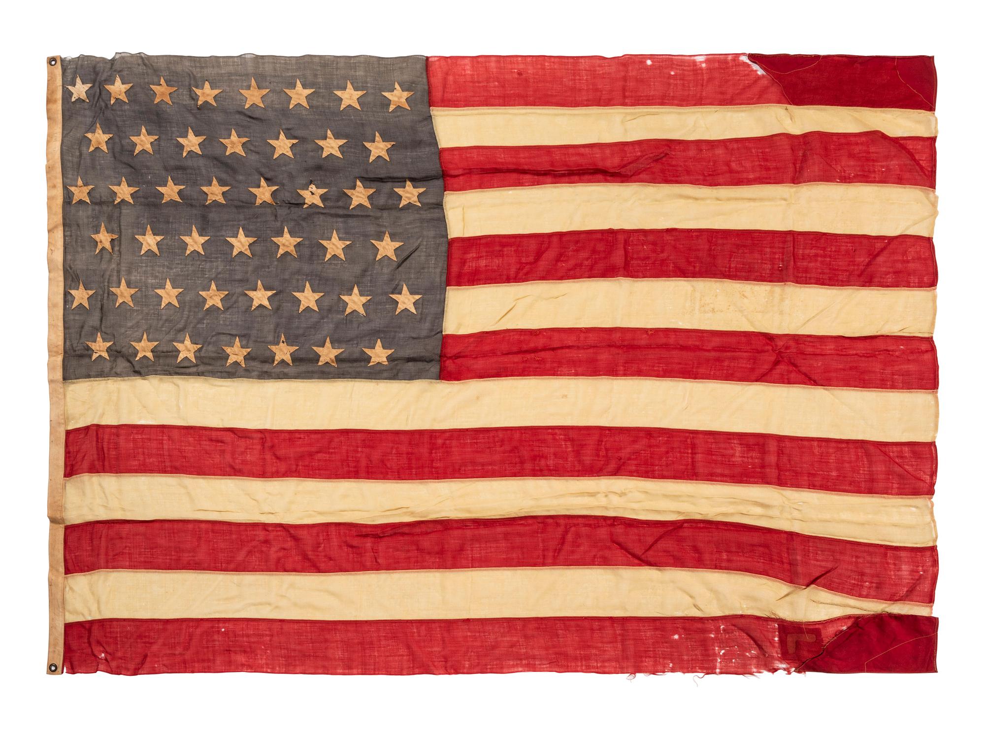 [SPANISH AMERICAN WAR]. 45-star Spanish American War-era flag identified to George W. Potter, Company K, 2nd Massachusetts Infantry, with related stereoviews, bookends, and other imprints.