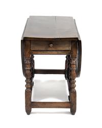 An English Oak Gate Leg Table Height 29 1/2 x width 52 x depth 21 inches (closed).