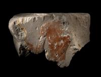 An Egyptian Painted Limestone Relief Fragment with a Torso