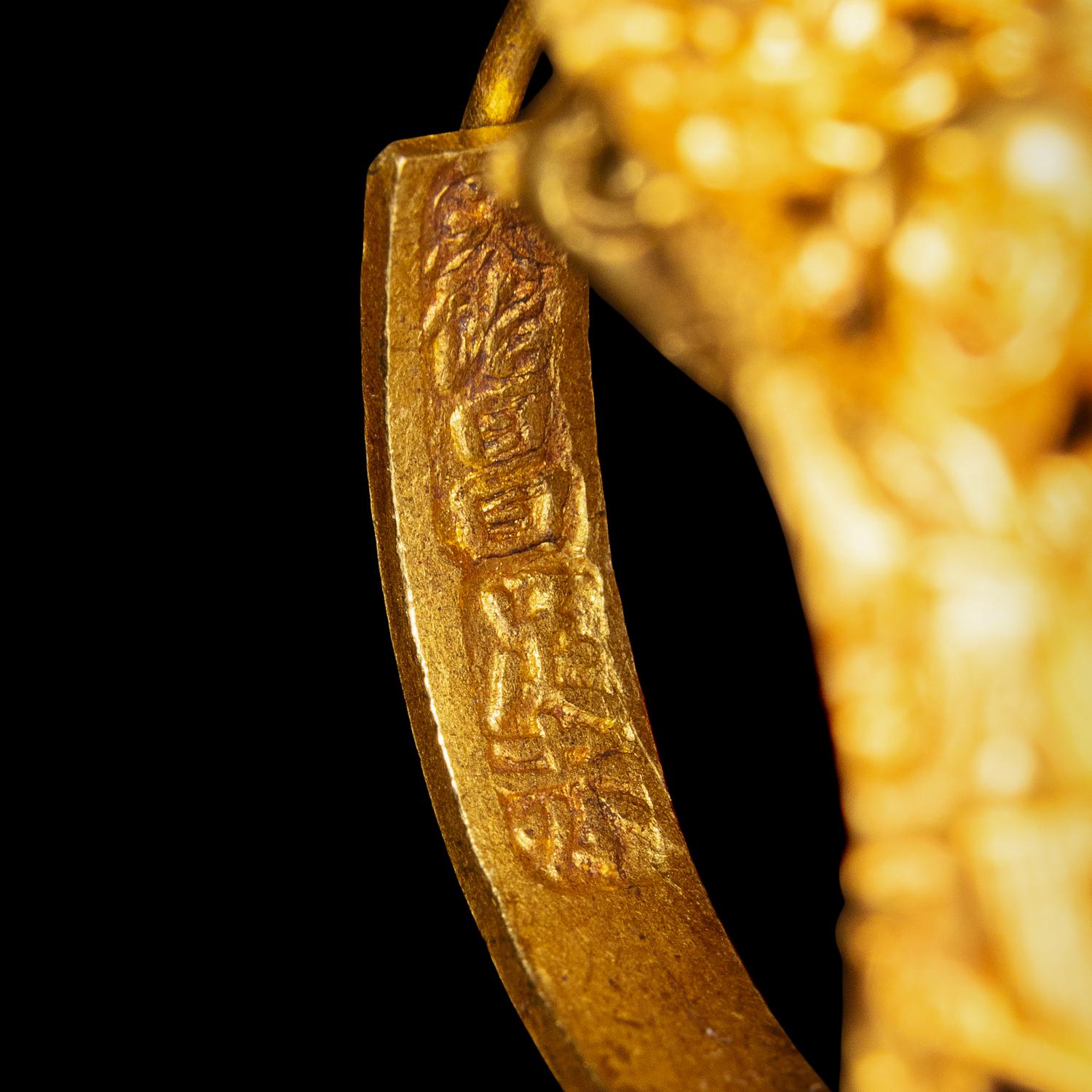 A Pair of Chinese Gold 'Figural and Fruits' Plaque Earrings, Paihuan, Qing Dynasty 清 童子瓜果紋 金 牌環一對