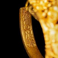 A Pair of Chinese Gold 'Figural and Fruits' Plaque Earrings, Paihuan, Qing Dynasty 清 童子瓜果紋 金 牌環一對
