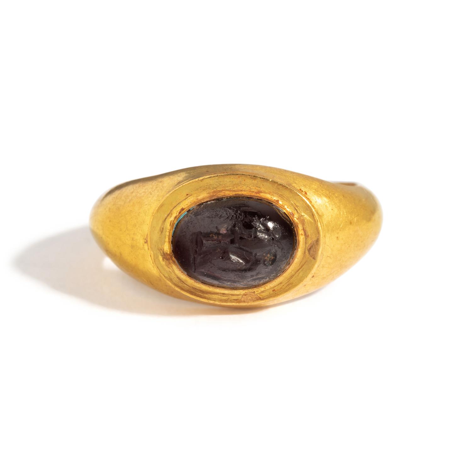 A Roman Gold and Garnet Finger Ring with the Goddesses Athena and Nike