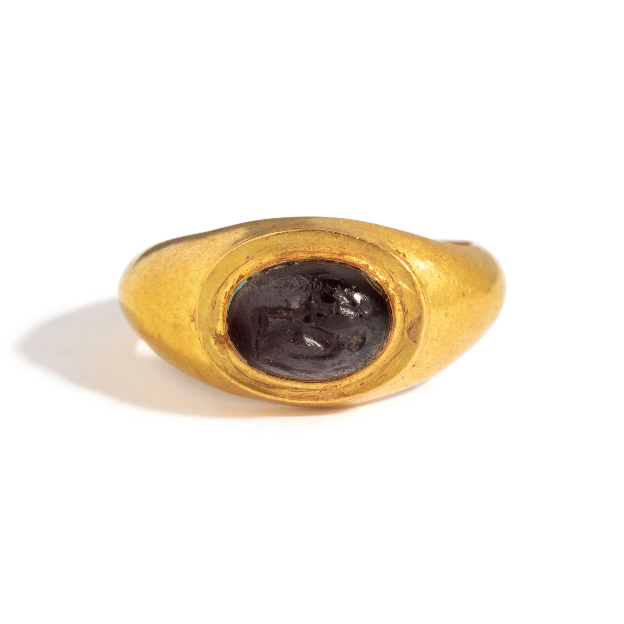 A Roman Gold and Garnet Finger Ring with the Goddesses Athena and Nike