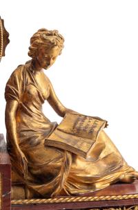 A Louis XVI Style Gilt Bronze and Rouge Griotte Marble Mantel Clock