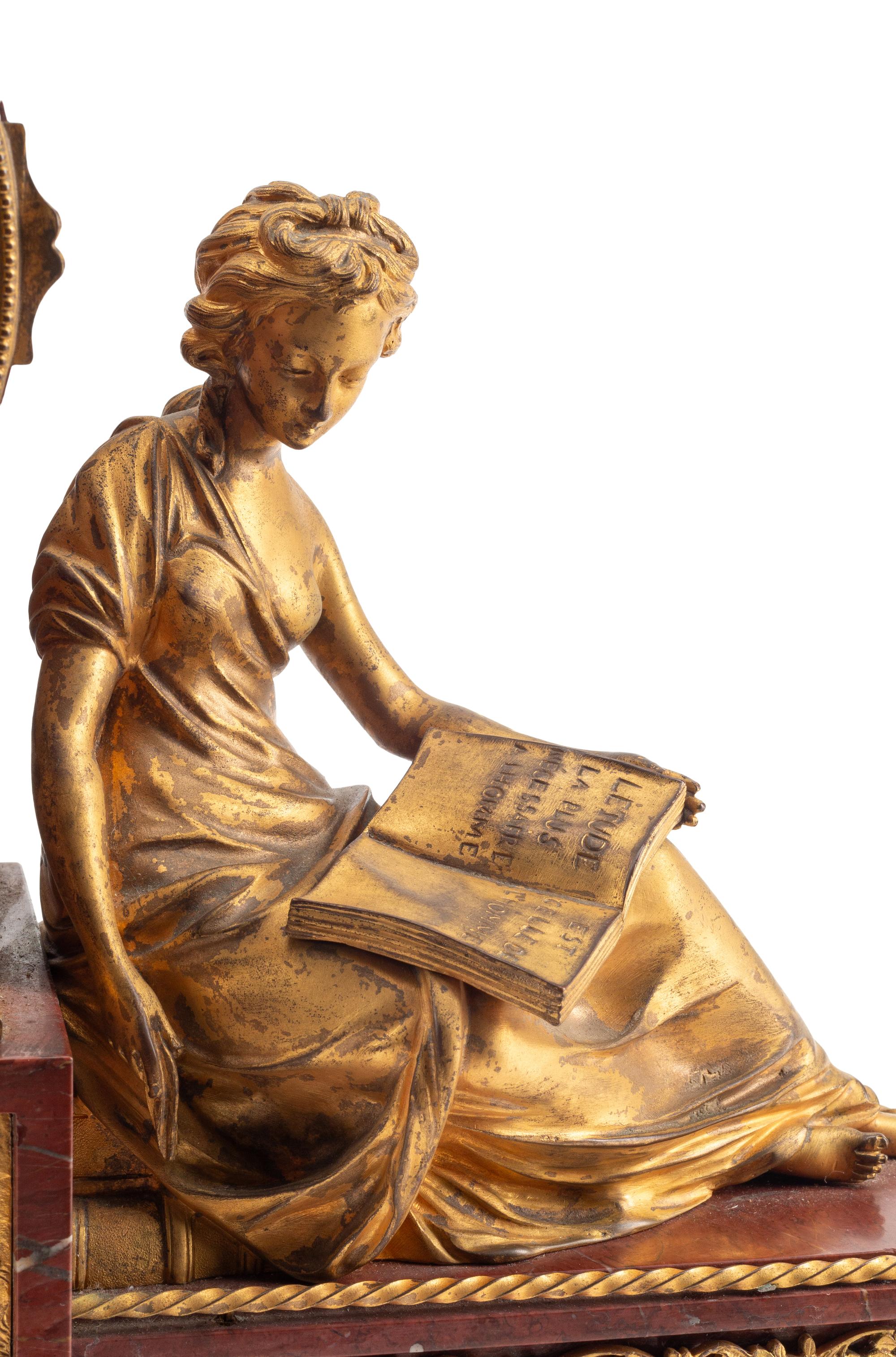 A Louis XVI Style Gilt Bronze and Rouge Griotte Marble Mantel Clock