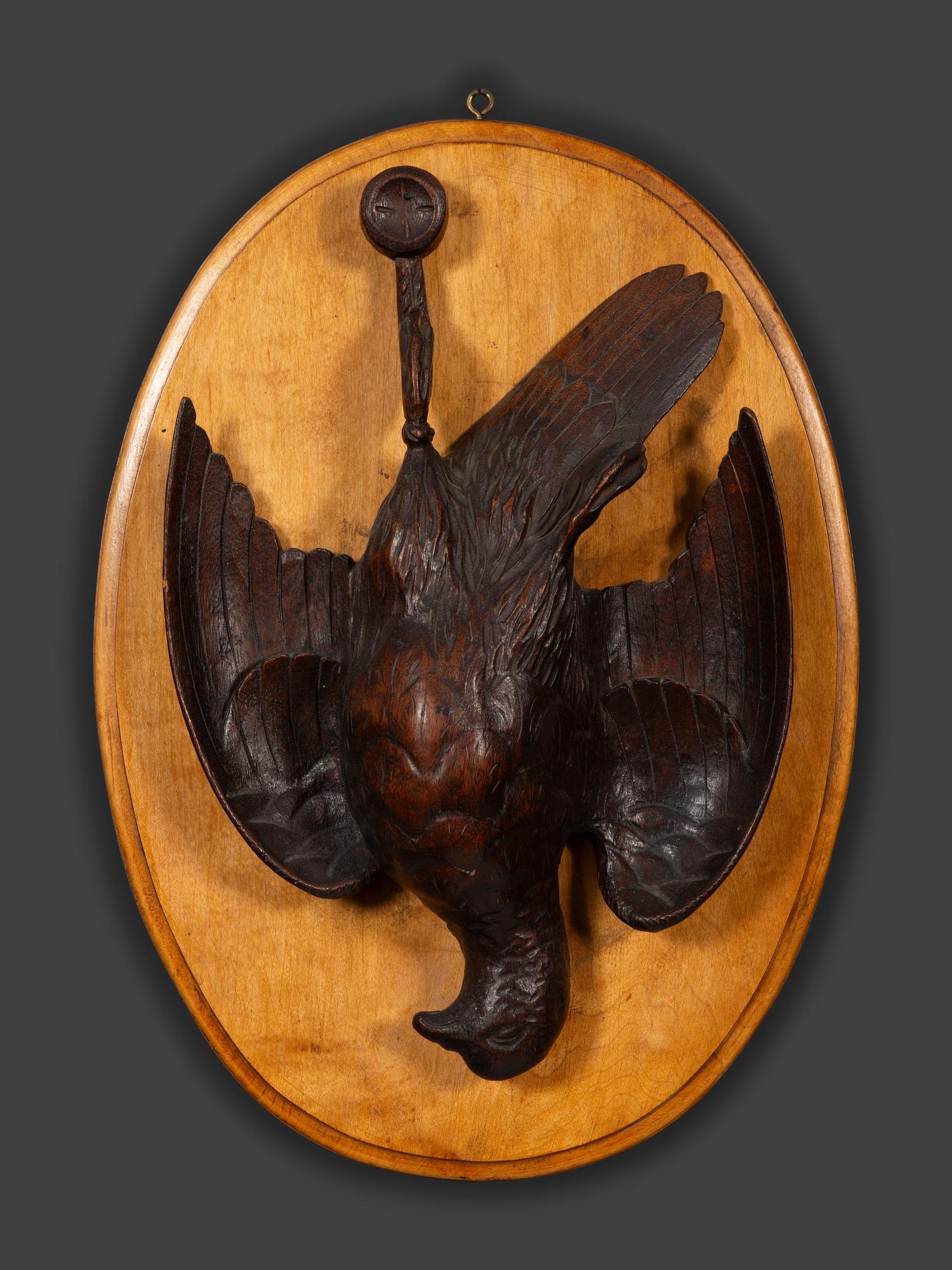 A Pair of Black Forest Style Carved Wood Game Plaques