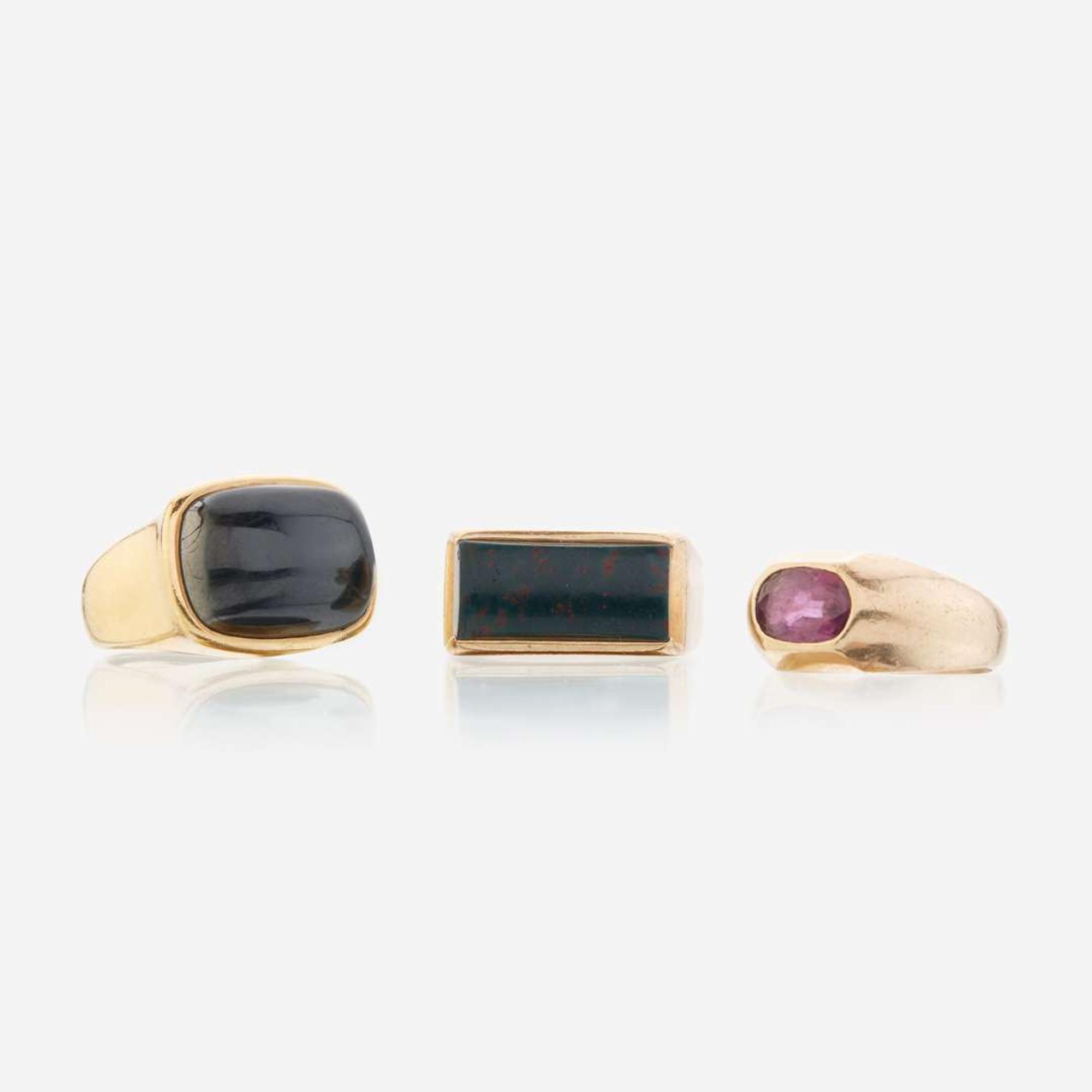 A collection of gold and gem-set rings