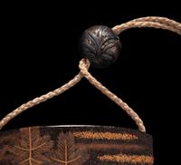 A Japanese Gold and Black Four-Case Inro