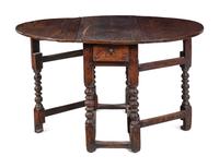 A William and Mary Carved Oak Gate-Leg and Drop-Leaf Table