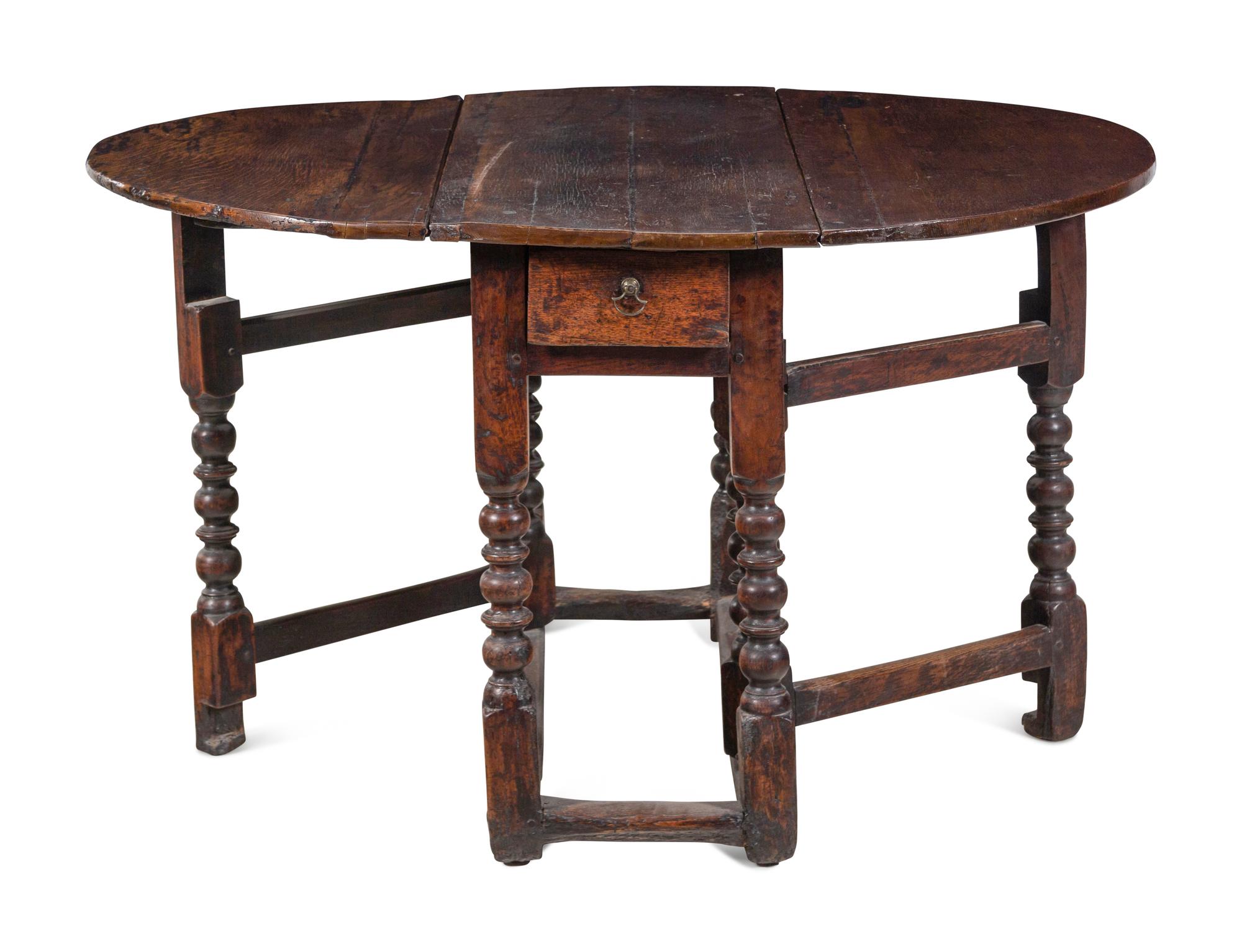 A William and Mary Carved Oak Gate-Leg and Drop-Leaf Table