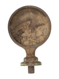 A Pair of Cast Iron Kettle Toppers and Two Trivets