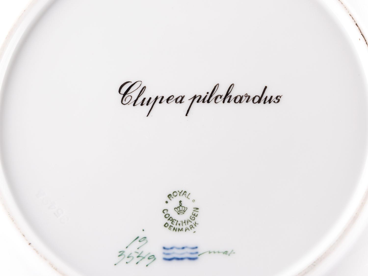A Set of Twelve Royal Copenhagen Parcel Gilt Porcelain Fish Plates
