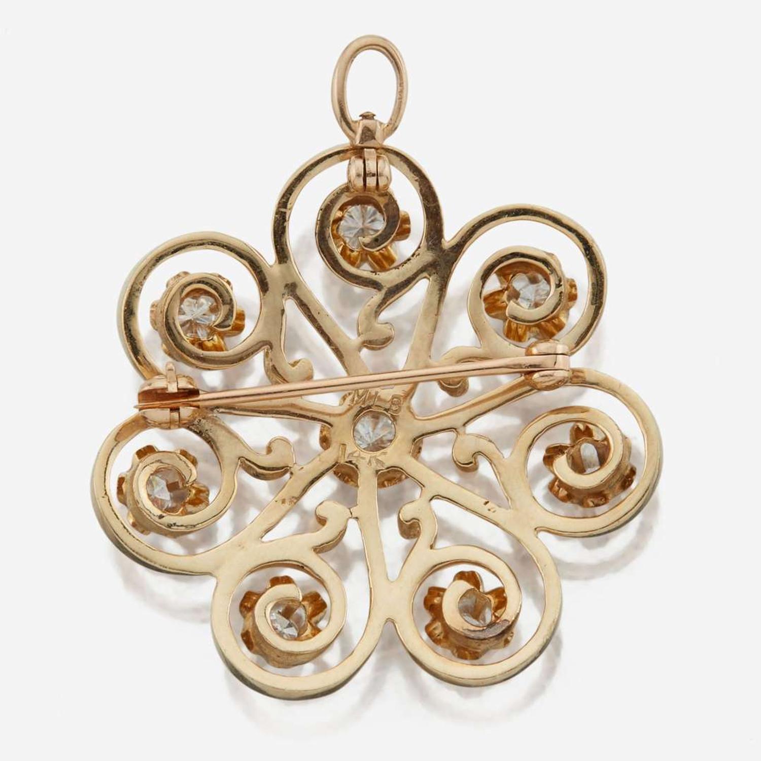 A 14K yellow gold and diamond pendant/brooch