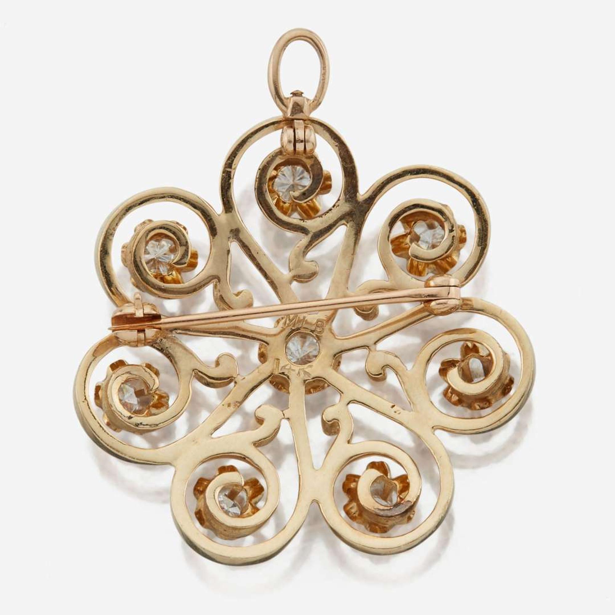 A 14K yellow gold and diamond pendant/brooch