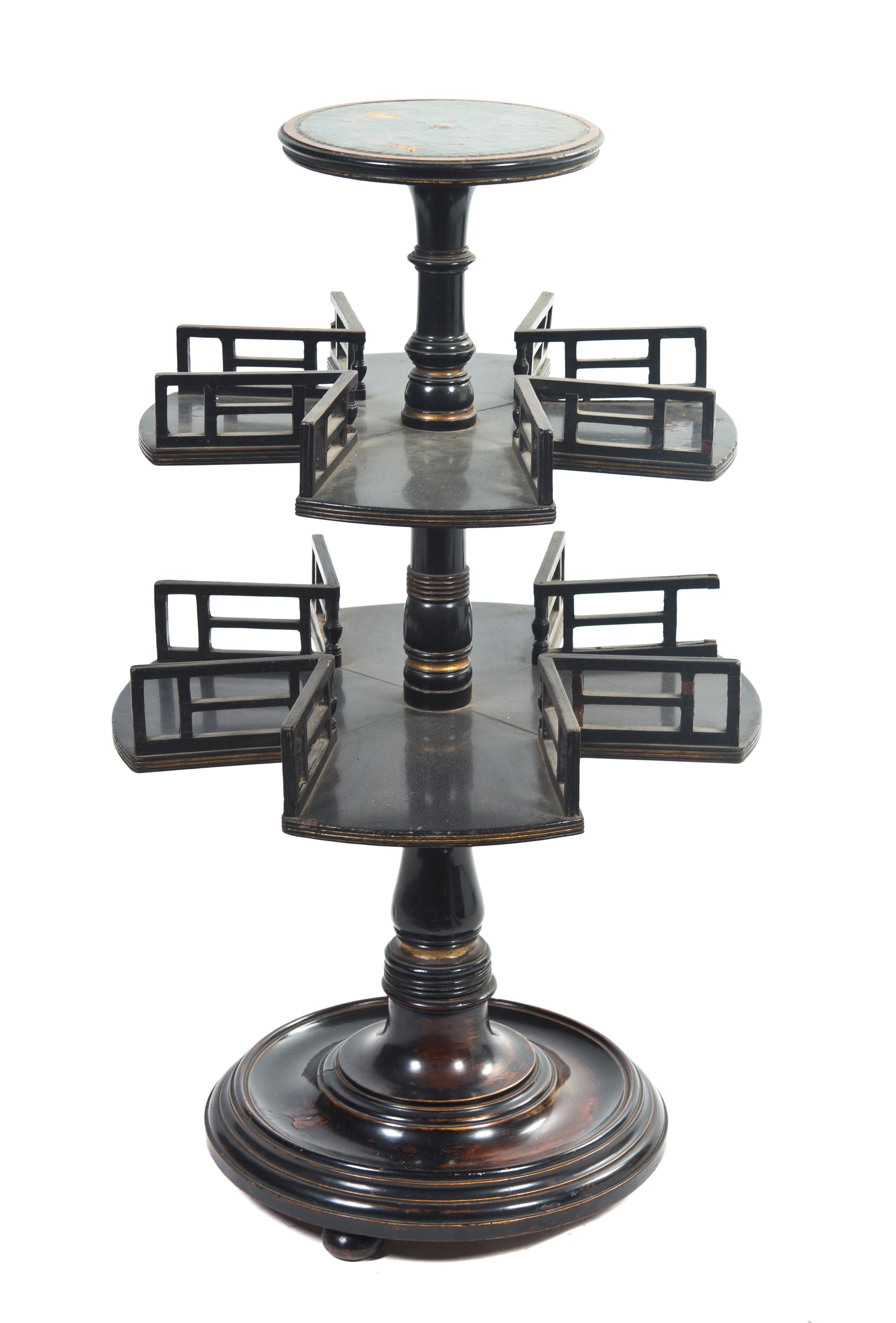 A Regency Ebonized and Parcel Gilt Book Mill, Height 31 1/2 inches.