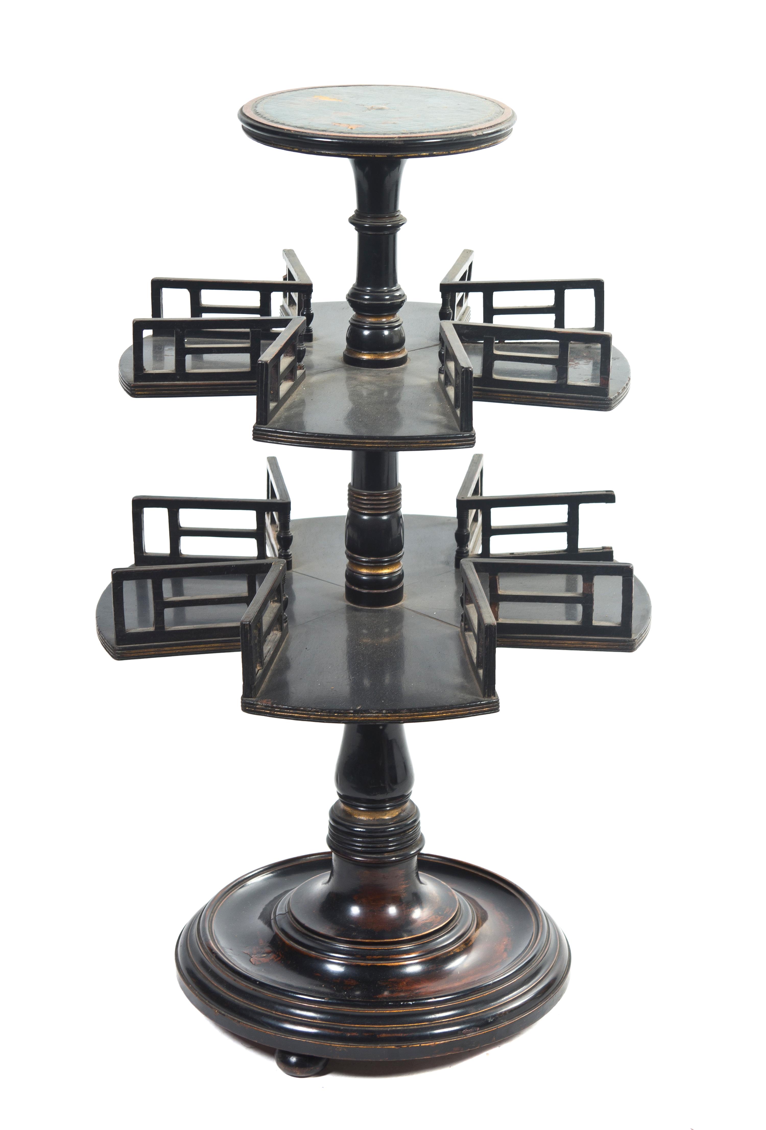 A Regency Ebonized and Parcel Gilt Book Mill, Height 31 1/2 inches.