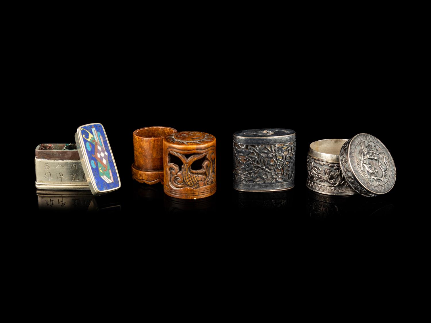 Four Chinese Covered Boxes and A Silvered Metal Mounted Bamboo Opium Pipe