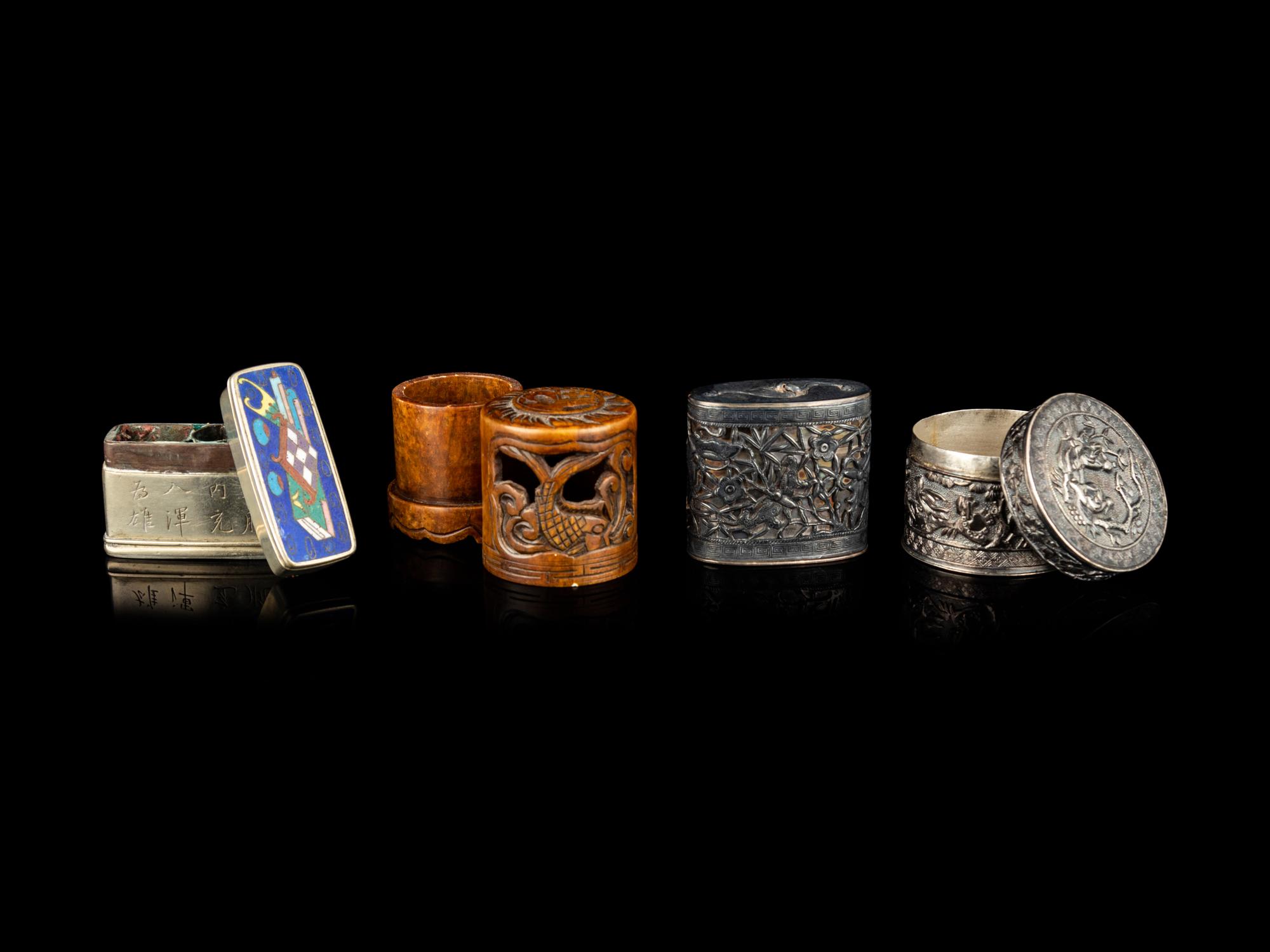 Four Chinese Covered Boxes and A Silvered Metal Mounted Bamboo Opium Pipe