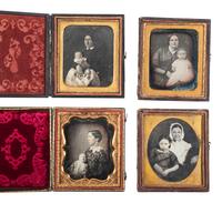 [EARLY PHOTOGRAPHY]. 18 daguerreotype portraits of parents with children, including: