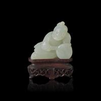 A Chinese White Jade Carved Boy, Qing Dynasty 清 白玉雕弄鼓童子