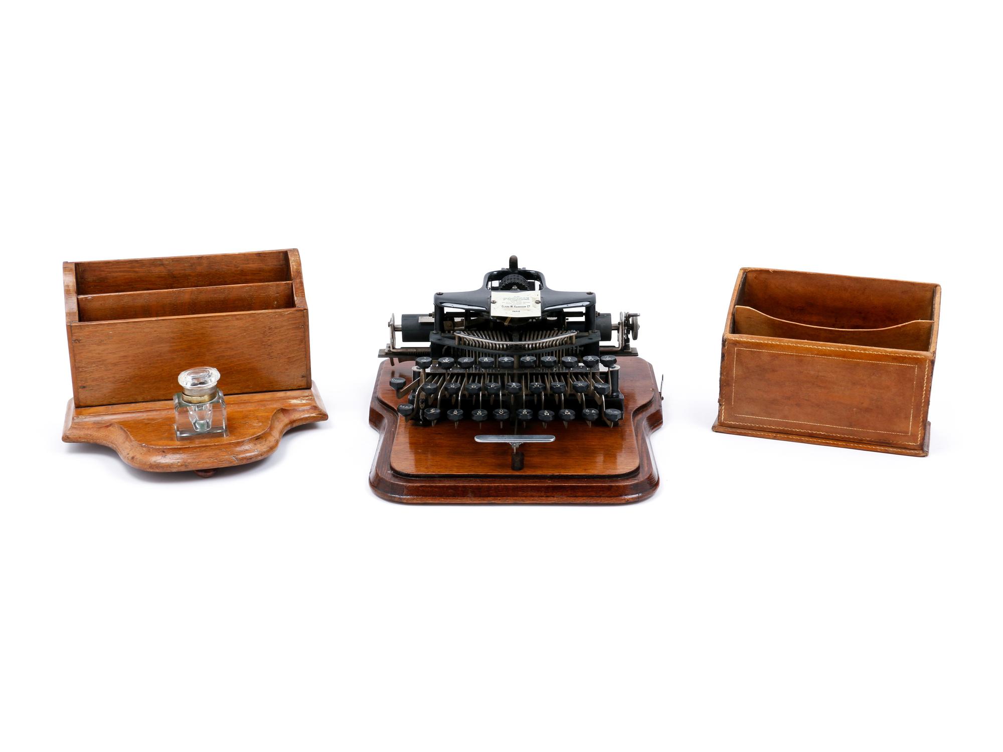 A Postal No. 5 Typewriter with a Wood Case