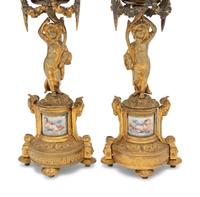 A Pair of French Porcelain Mounted Gilt Bronze Figural Lamps