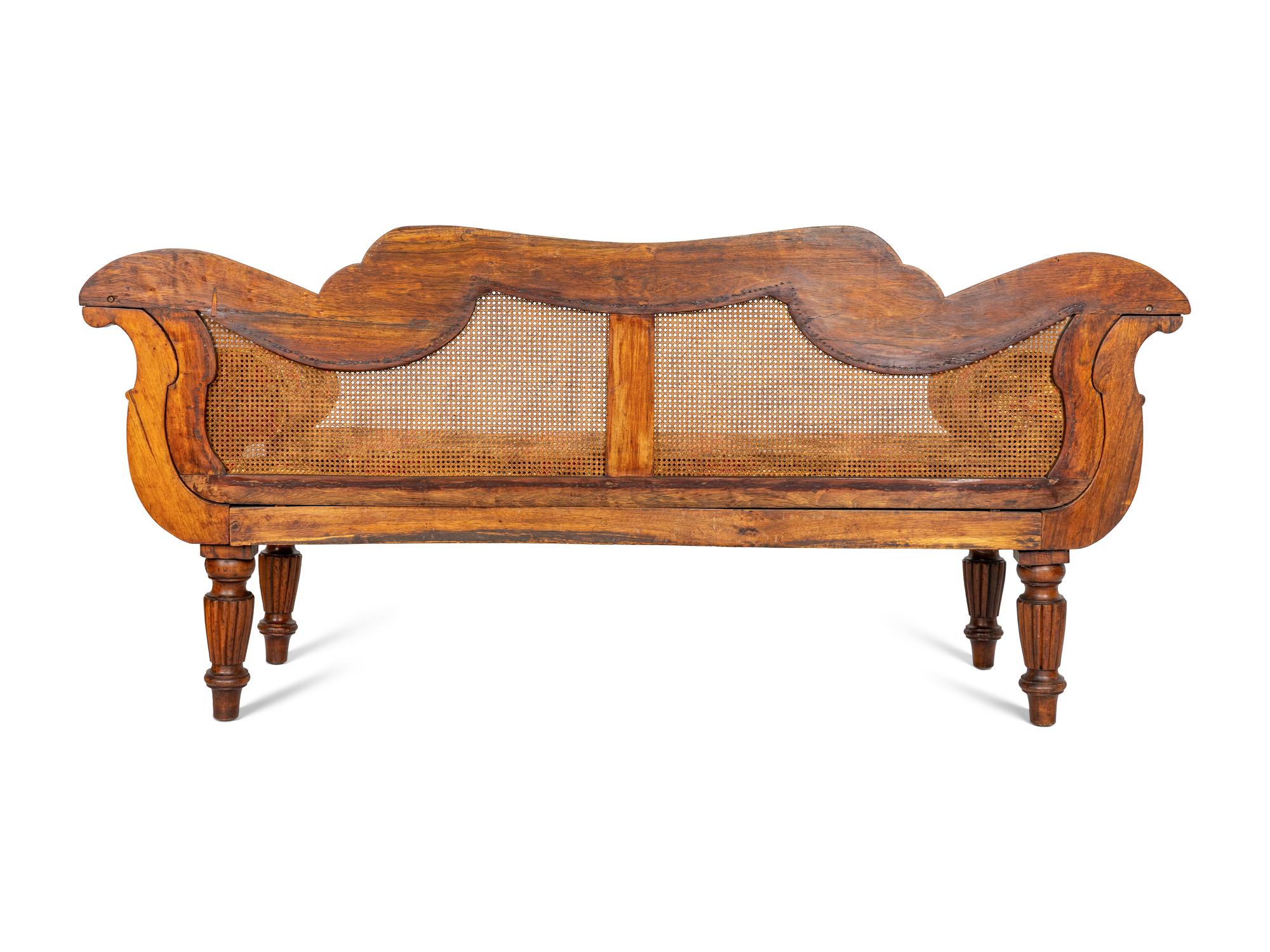 An Anglo-Colonial Carved and Caned Rosewood Settee
