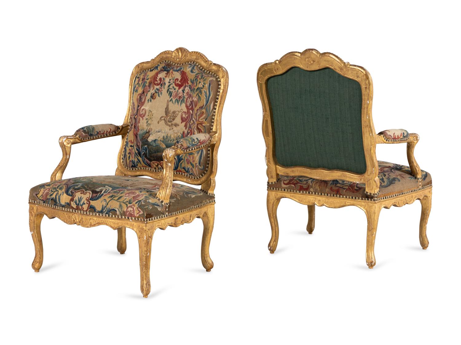 A Pair of Régence Tapestry-Upholstered Giltwood Fauteuils