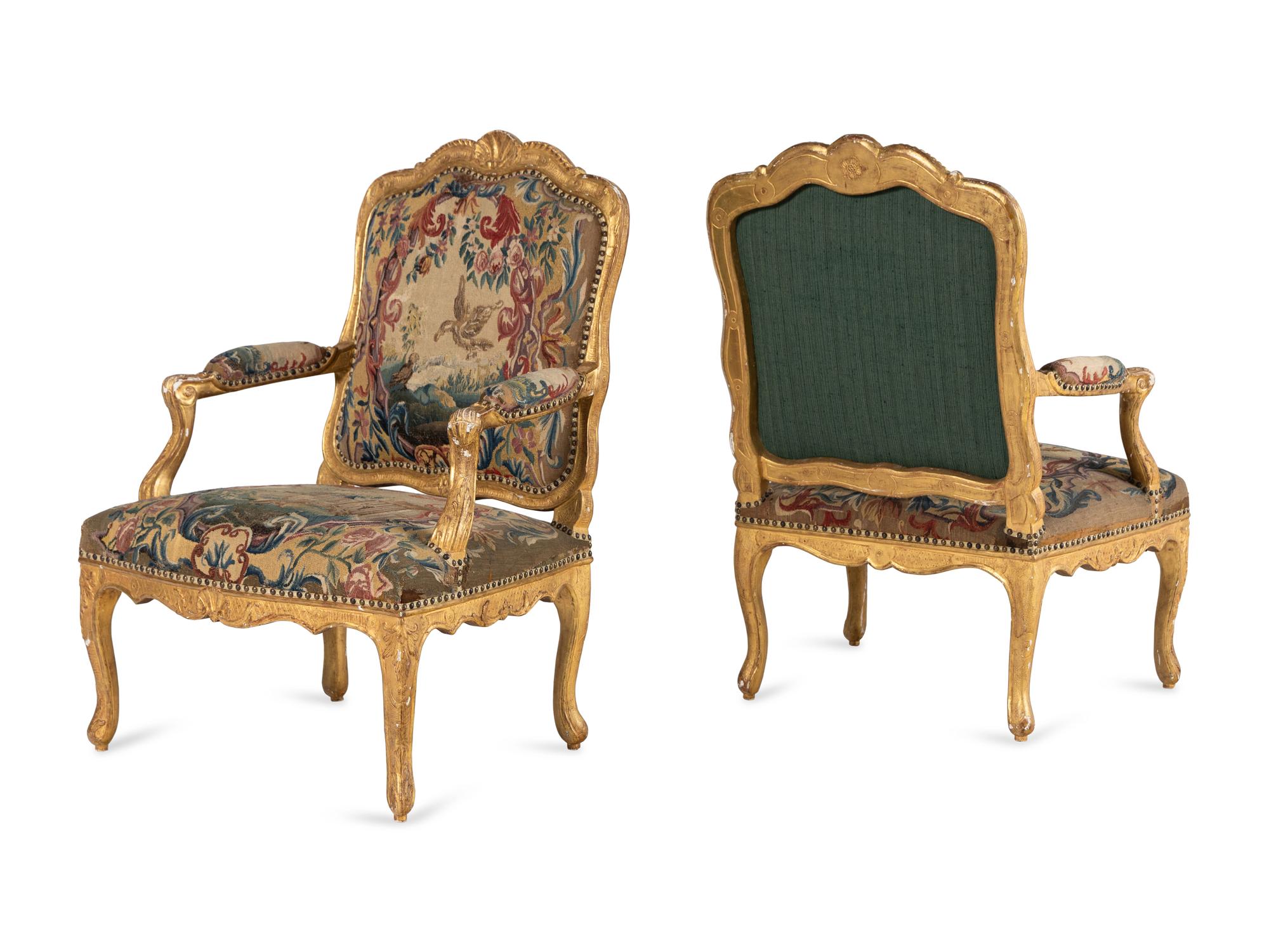 A Pair of Régence Tapestry-Upholstered Giltwood Fauteuils