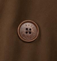 Three Designer Outerwear Pieces: One The Row Trench, One Gucci Trench, and One Armani Knit Jacket