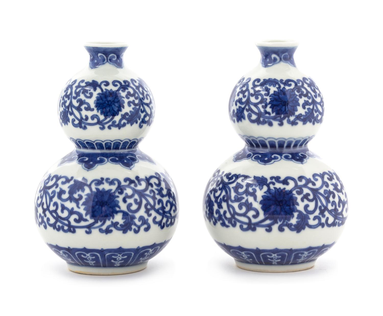 A Pair of Blue and White Porcelain Vases Height 5 3/8 inches.