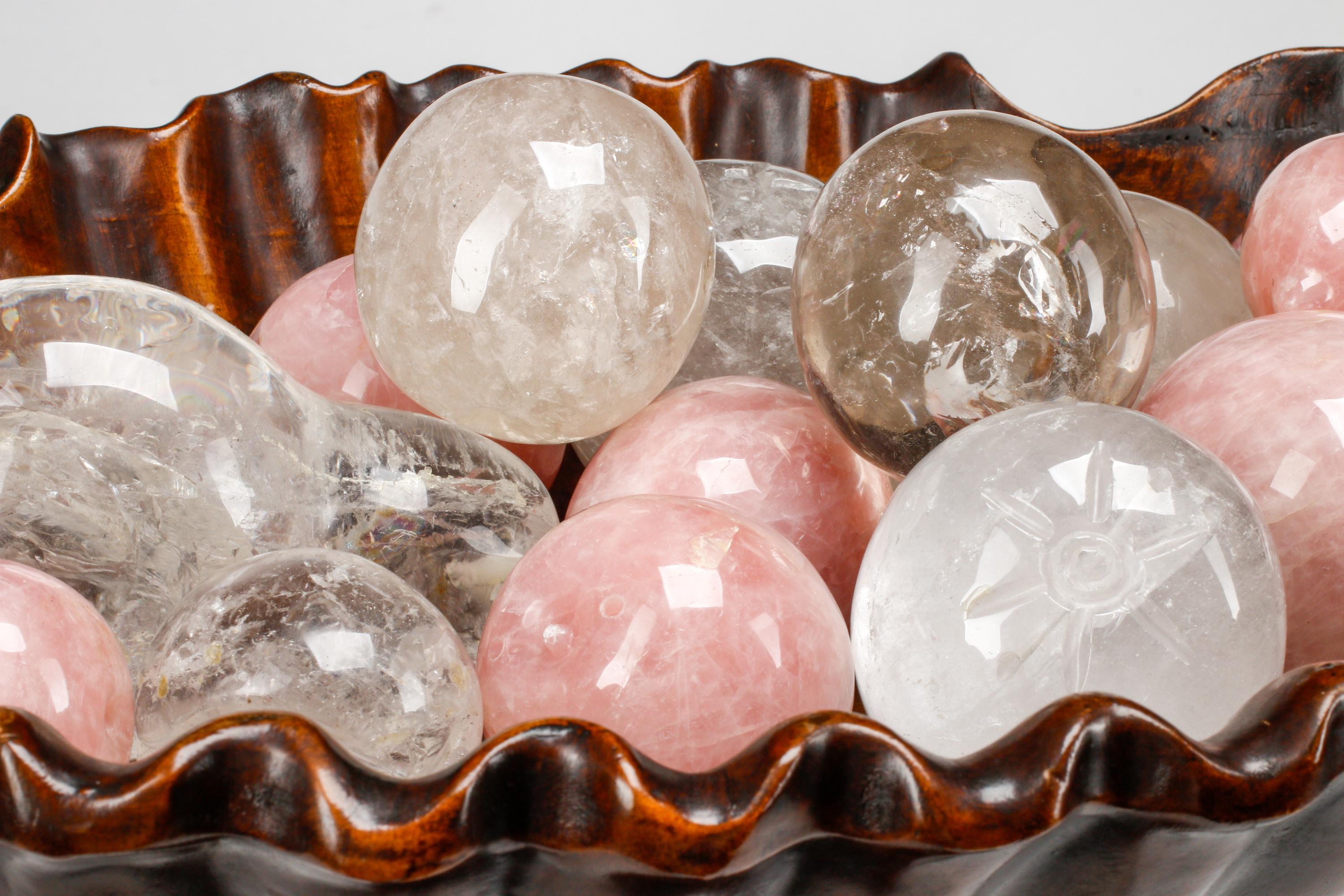 An Italian Baroque Style Carved Wood Jardinière with a Collection of Rock Crystal and Rose Quartz Fruit
