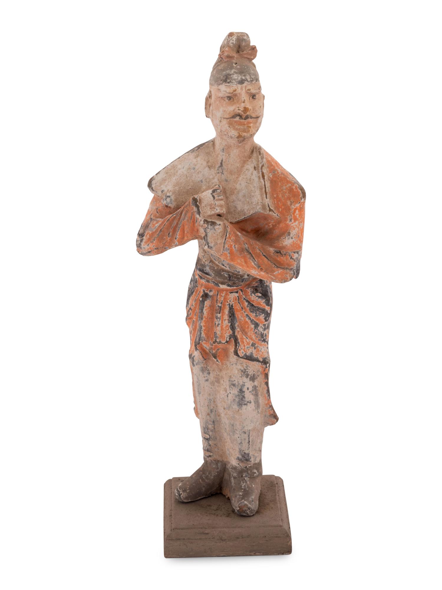 A Chinese Painted Pottery Figure of a Foreign Groom