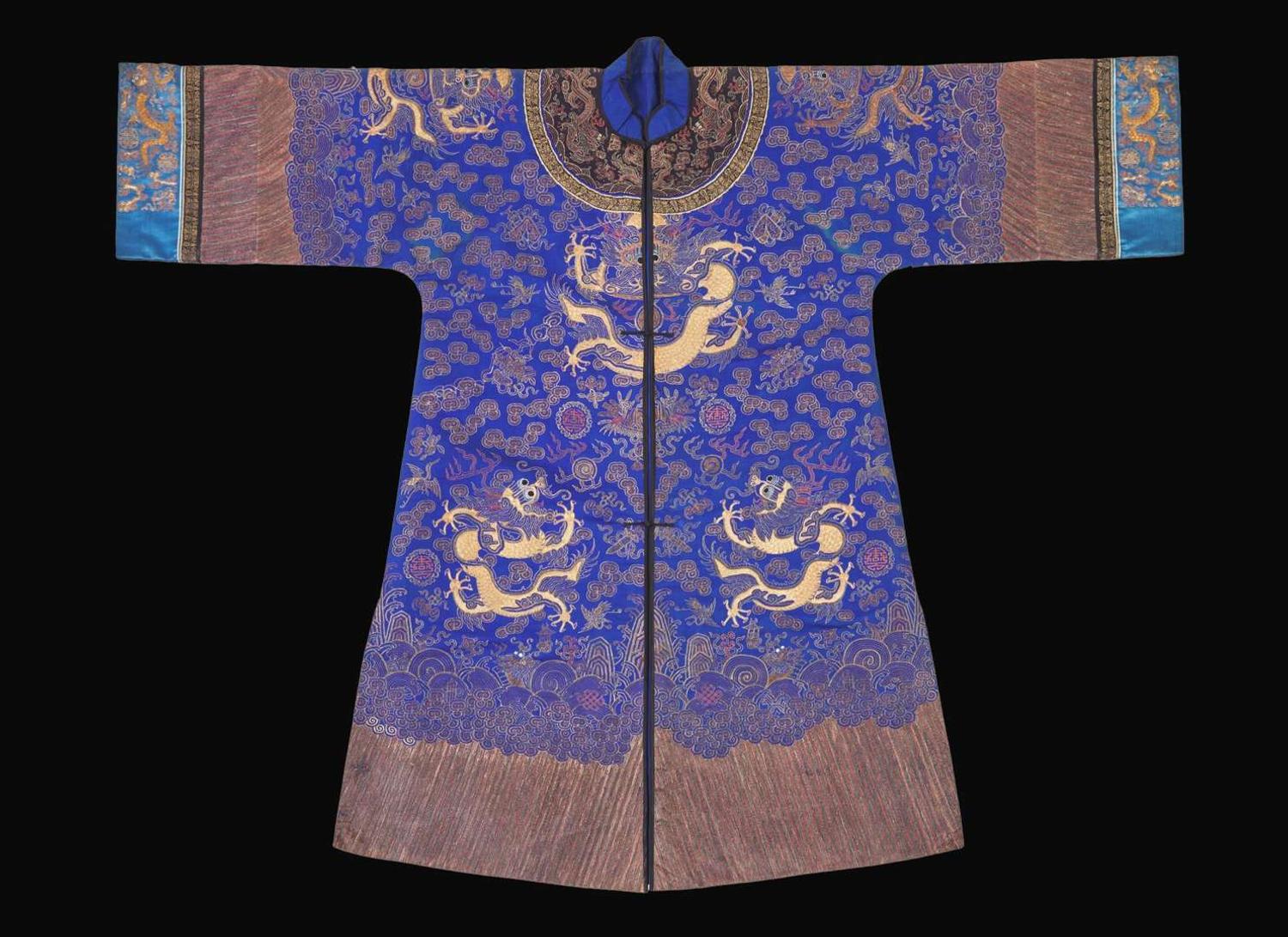 A Chinese embroidered blue silk "Dragon" surcoat, late Qing dynasty 刺繡藍地龍袍 晚清