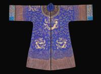 A Chinese embroidered blue silk "Dragon" surcoat, late Qing dynasty 刺繡藍地龍袍 晚清