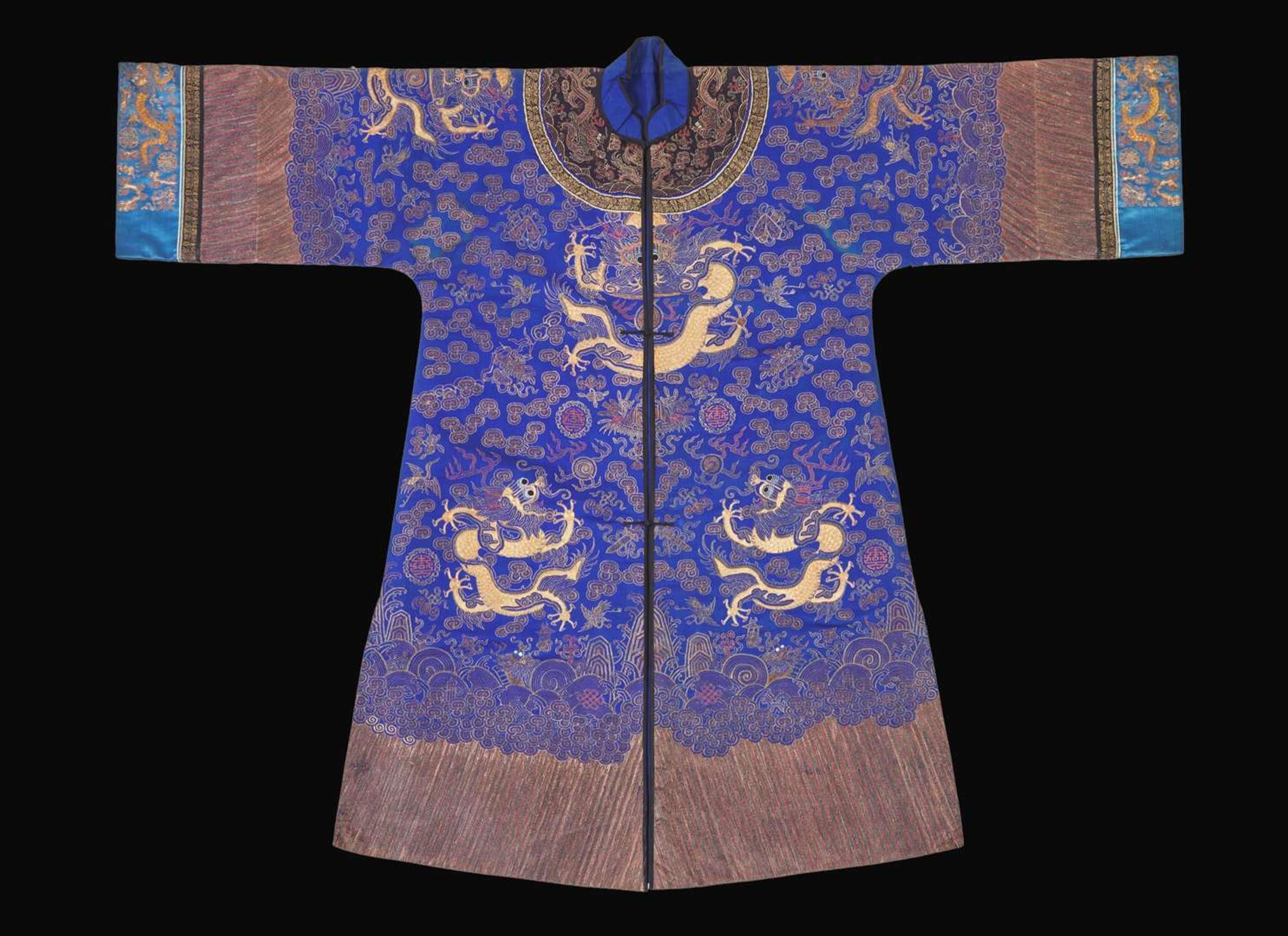 A Chinese embroidered blue silk "Dragon" surcoat, late Qing dynasty 刺繡藍地龍袍 晚清