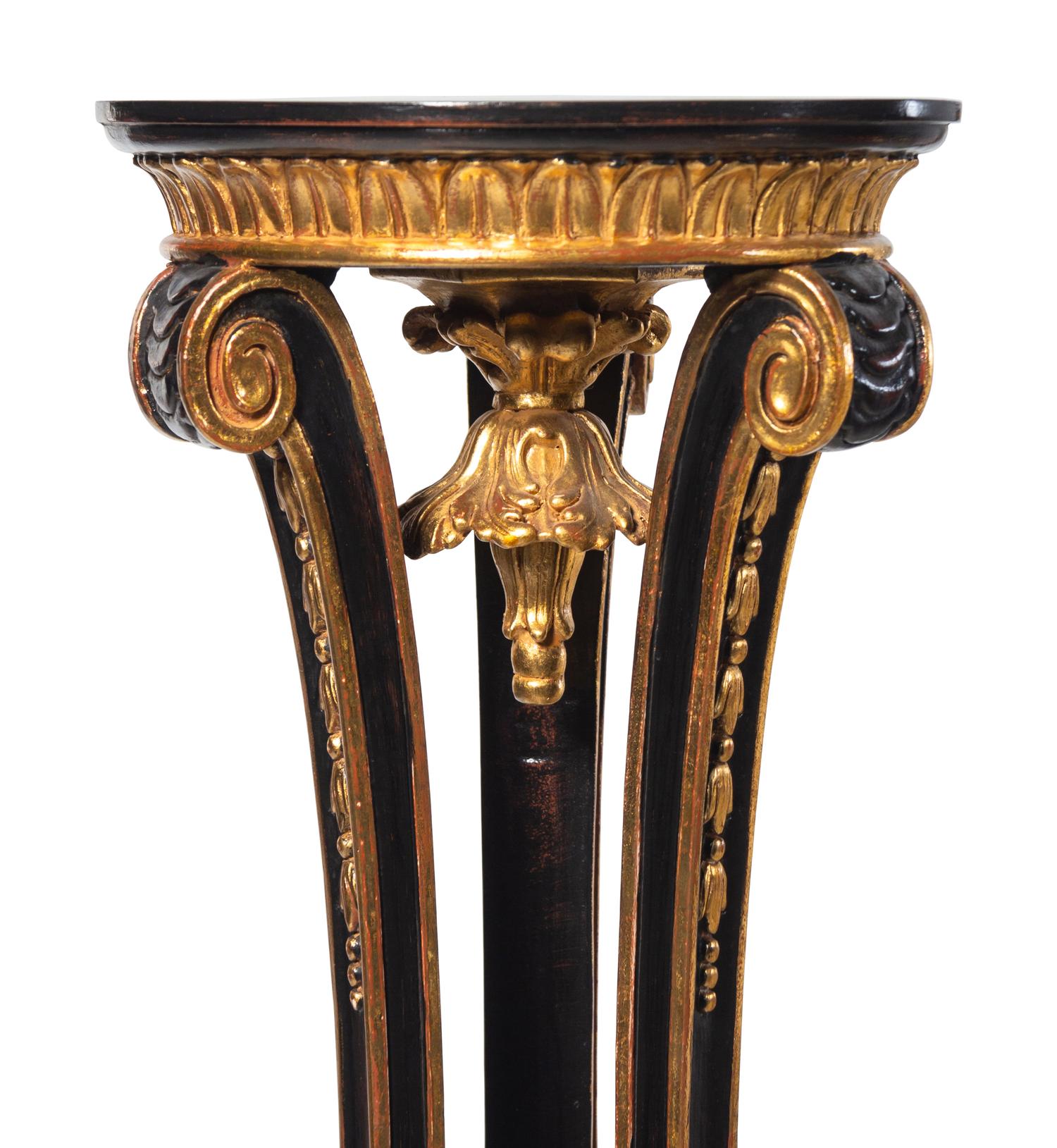 A Pair of Regency Style Black Painted and Parcel Gilt Pedestals