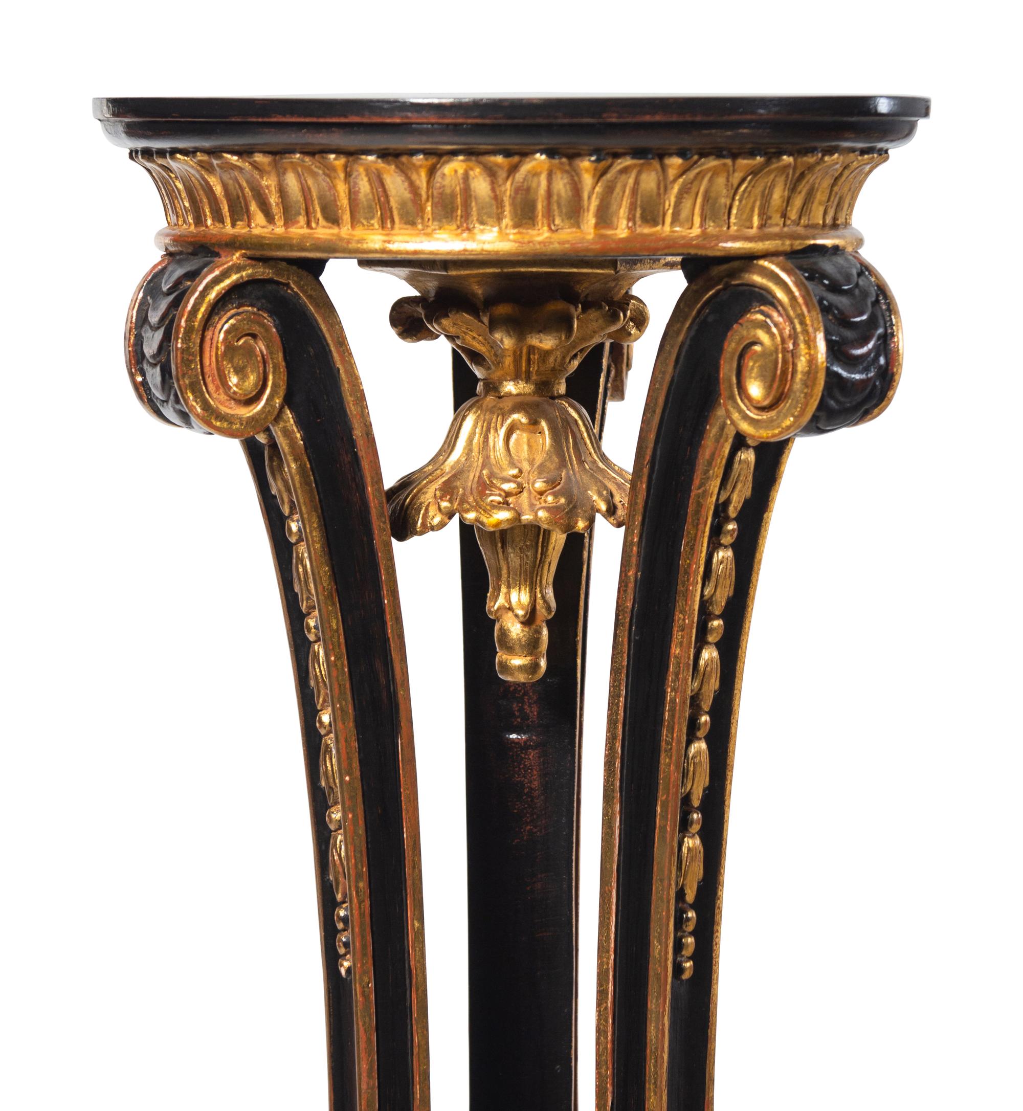 A Pair of Regency Style Black Painted and Parcel Gilt Pedestals